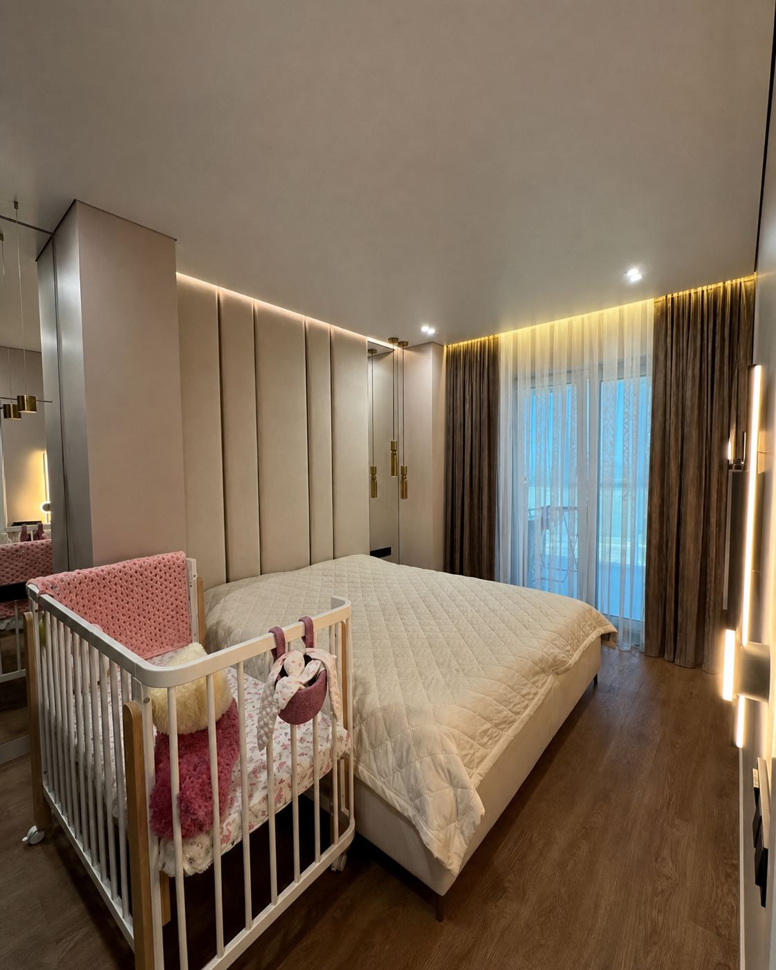 Bedroom · A warm perimeter glow above a padded headboard wall