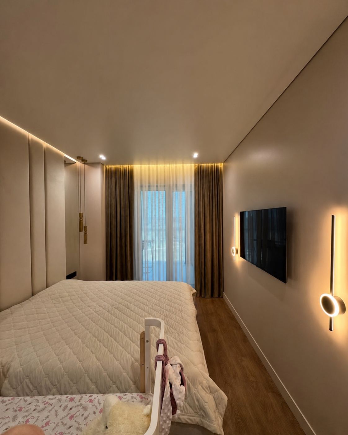 Bedroom · The edge-lit ceiling tracing the curtain wall
