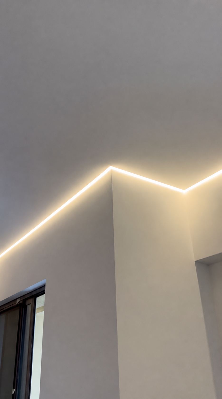 The edge-lit reveal tracing a corner