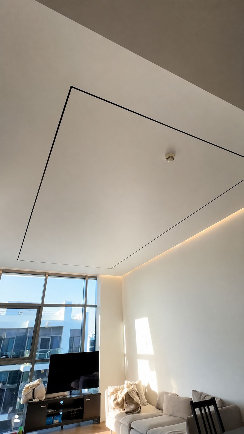Living Room · The floating tier over the seating area
