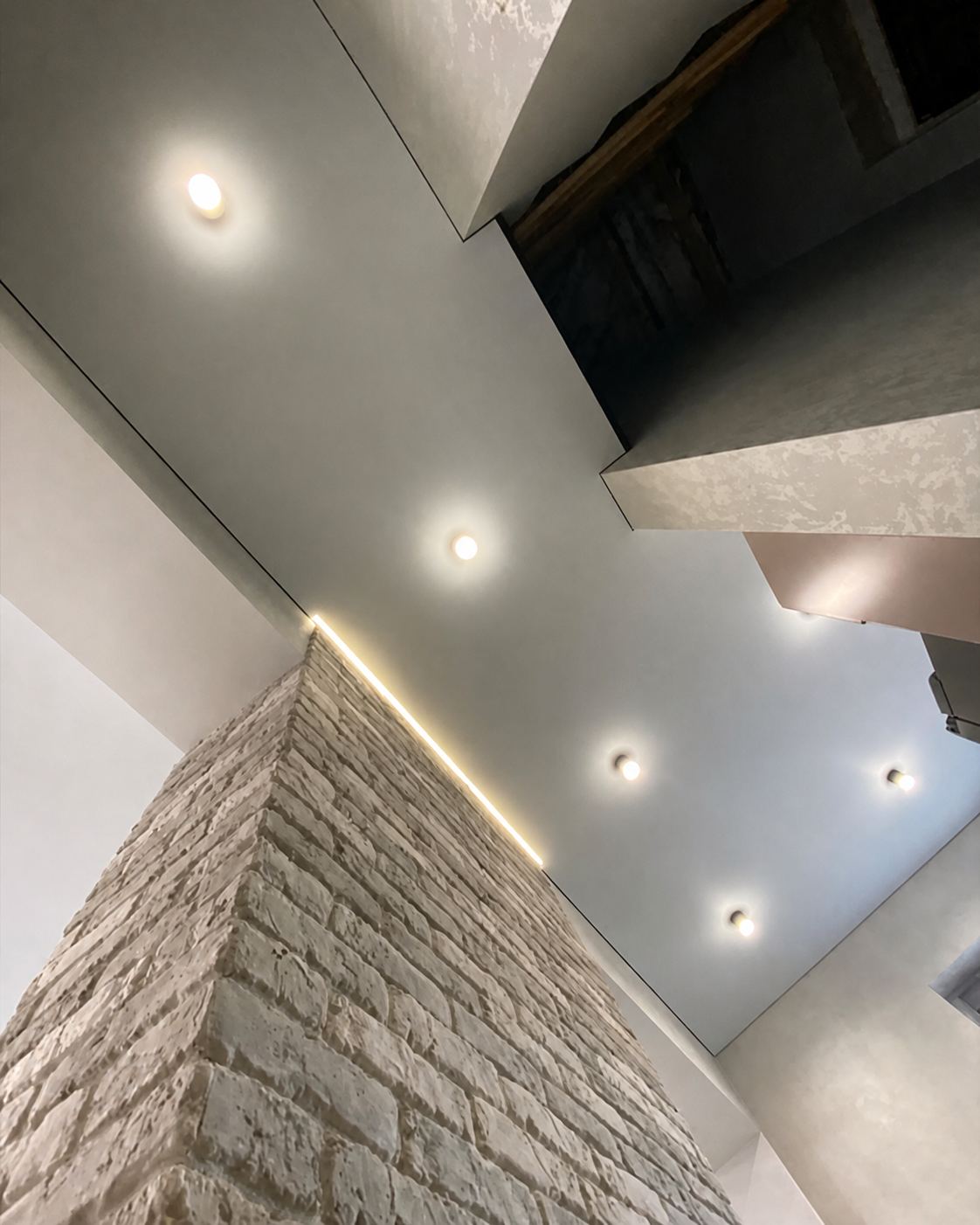 The reveal tracing the brick edge, lit from within