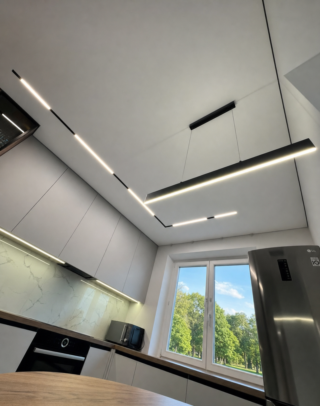 A magnetic track run angled across a kitchen ceiling