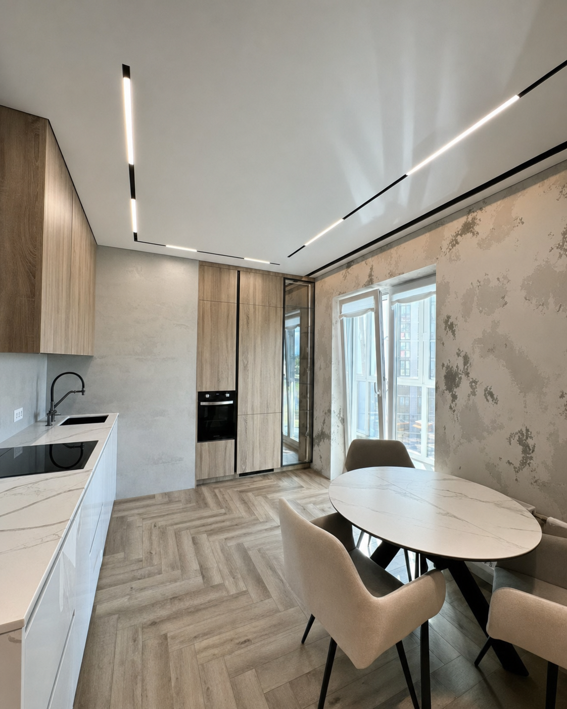 Natural light and the ceiling channel meeting at a textured feature wall